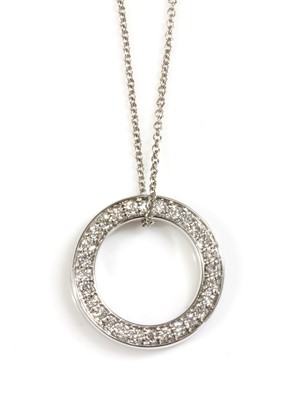 Lot 434 - An 18ct white gold diamond set circle or hoop slider pendant