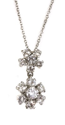 Lot 425 - An 18ct white gold diamond set double cluster drop pendant