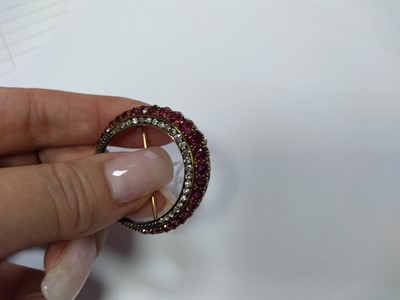 Lot 43 - A late Victorian ruby and diamond closed crescent brooch