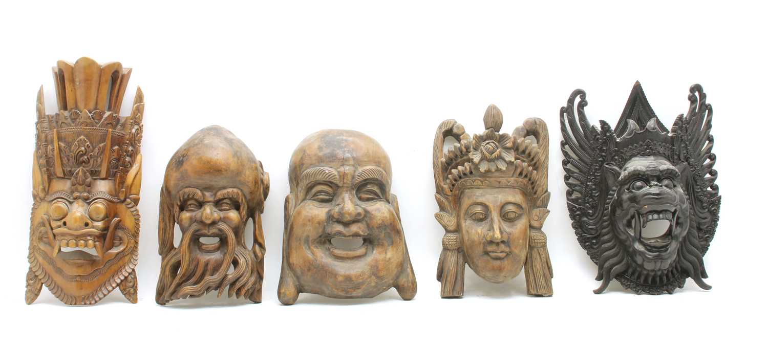 Lot 187 - A collection of Far Eastern carved hardwood masks