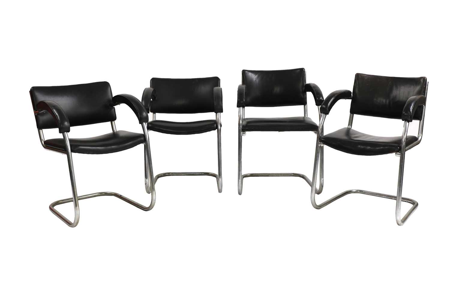 Lot 86 - A set of four black leather and chrome cantilever chairs