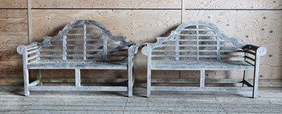 Lot 993 - A pair of Lutyens-style weathered teak garden benches