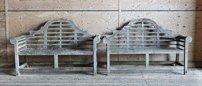 Lot 988 - A pair of Lutyens-style weathered teak garden benches