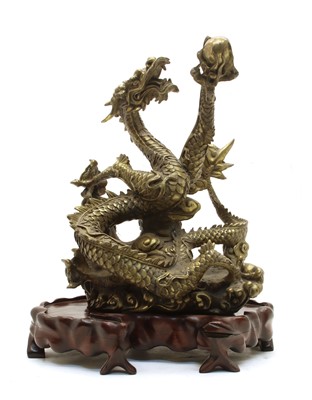 Lot 303 - A Japanese brass model of an entwined dragon