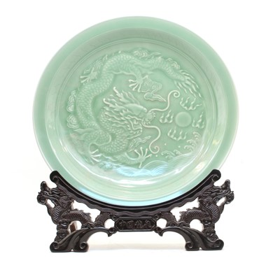 Lot 267 - A Chinese celedon charger