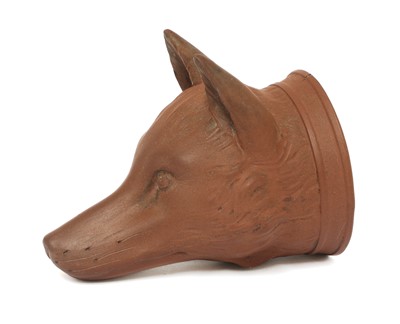 Lot 152 - A rare Staffordshire redware fox mask stirrup cup
