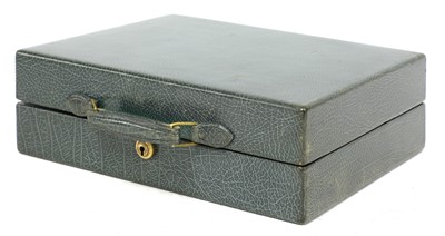 Lot 55 - A green leather vanity case by Cartier