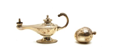 Lot 39 - An Edwardian silver 'Aladdin' lamp cigar lighter by Asprey & Co., and a pomander (2)