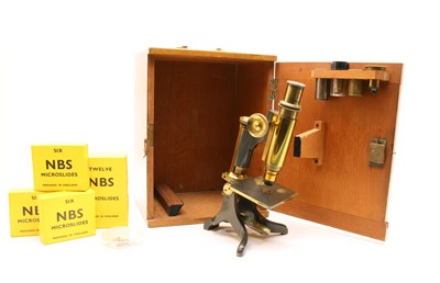 Lot 260 - A mahogany cased brass monocular microscope