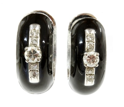 Lot 377 - A pair of white gold diamond and black enamel hinged hoop earrings