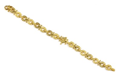 Lot 247 - An Asian high carat gold horseshoe bracelet