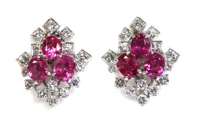 Lot 440 - A pair of white gold pink sapphire and diamond spray cluster earrings