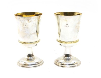 Lot 26 - A pair of sterling silver commemorative goblets, by Garrard & Co.