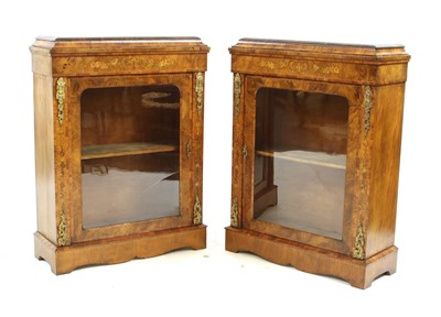 Lot 425 - A pair of strung walnut and crossbanded marquetry inlaid pier cabinets