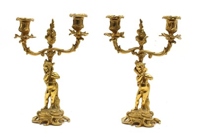 Lot 152 - A pair of 18th century style gilt metal two branch candelabra with figure columns