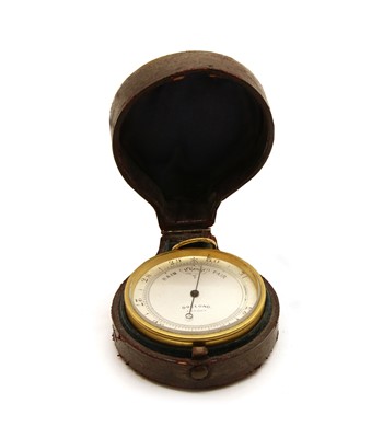 Lot 56 - A leather cased pocket aneroid barometer by Dolland, London