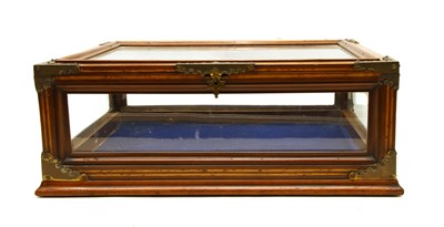 Lot 228 - A brass mounted mahogany table top vitrine