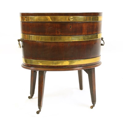 Lot 683 - A George III oval brass bound mahogany wine cooler