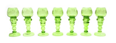 Lot 215 - Seven green glass roemers