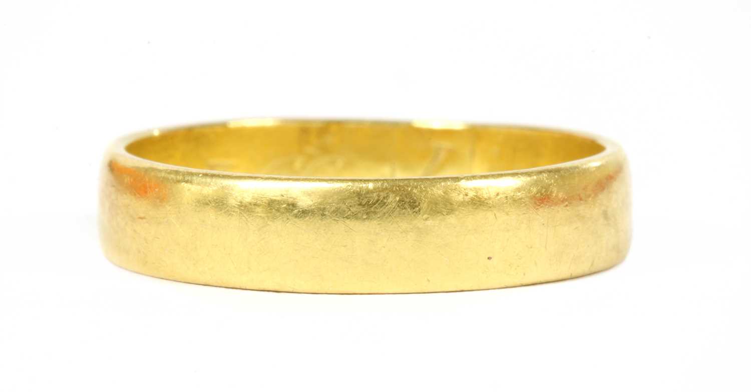 Lot 95 - A 22ct gold flat section wedding ring
