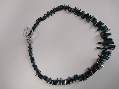Lot 206 - A platinum contemporary green tourmaline and diamond graduated necklace by Cox & Power