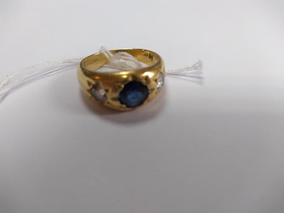 Lot 49 - A three stone sapphire and diamond gypsy ring