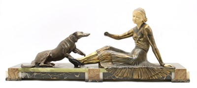 Lot 251I - An Art Deco bronze and ivorine figure of a reclined lady