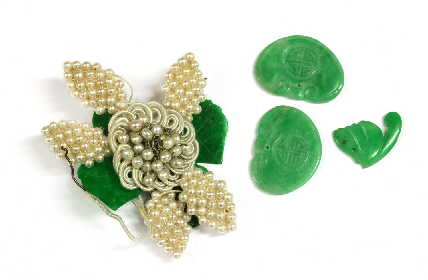 Lot 39 - A seed pearl and jade flower