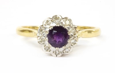 Lot 289 - An 18ct gold amethyst and diamond cluster ring
