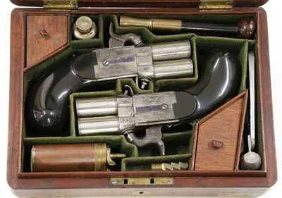 Lot 775 - A cased pair of turn-over barrel percussion pistols by Joseph Lang