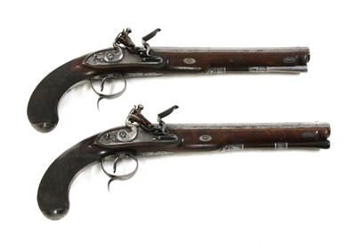 Lot 768 - A cased pair of flintlock full stock duelling pistols by P Bond