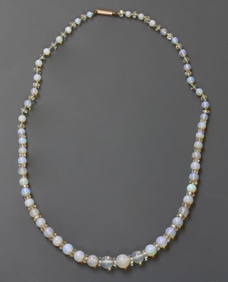 Lot 102 - A single row graduated opal and glass bead necklace
