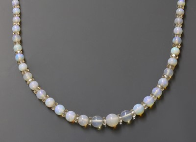 Lot 102 - A single row graduated opal and glass bead necklace