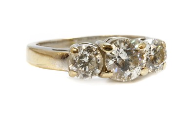 Lot 1197 - A white gold three stone diamond ring