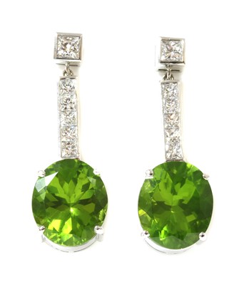 Lot 328 - A pair of white gold peridot and diamond drop earrings