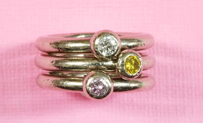 Lot 452 - A set of three 18ct white gold diamond set stacker rings