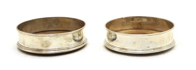 Lot 187 - A matched pair of sterling silver wine coasters