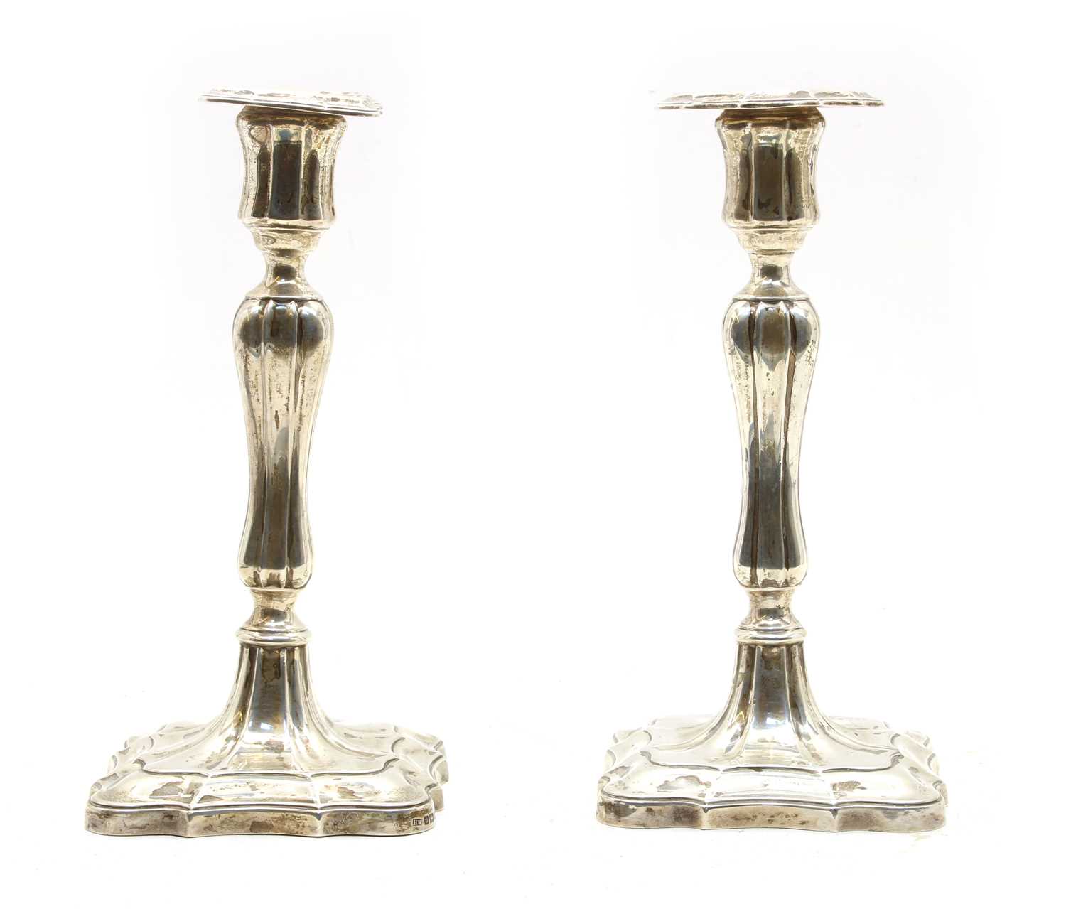 Lot 61 - A pair of  Edwardian silver candlesticks