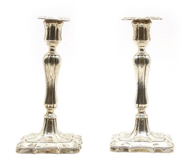 Lot 61 - A pair of  Edwardian silver candlesticks
