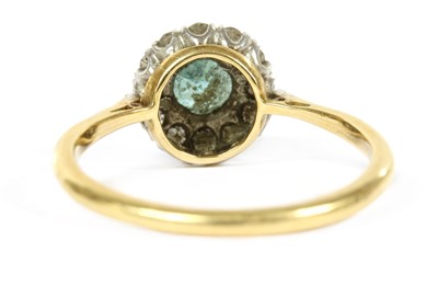Lot 283 - A gold blue zircon and diamond halo cluster ring