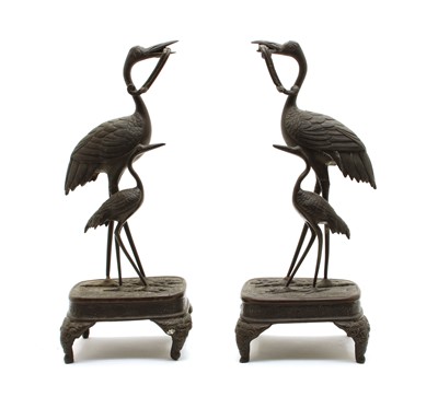 Lot 300 - A pair of Japanese bronze candle holders