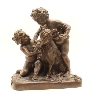 Lot 154 - A bronze figure of children feeding a goat