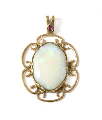 Lot 271 - A 9ct gold opal and ruby pendant