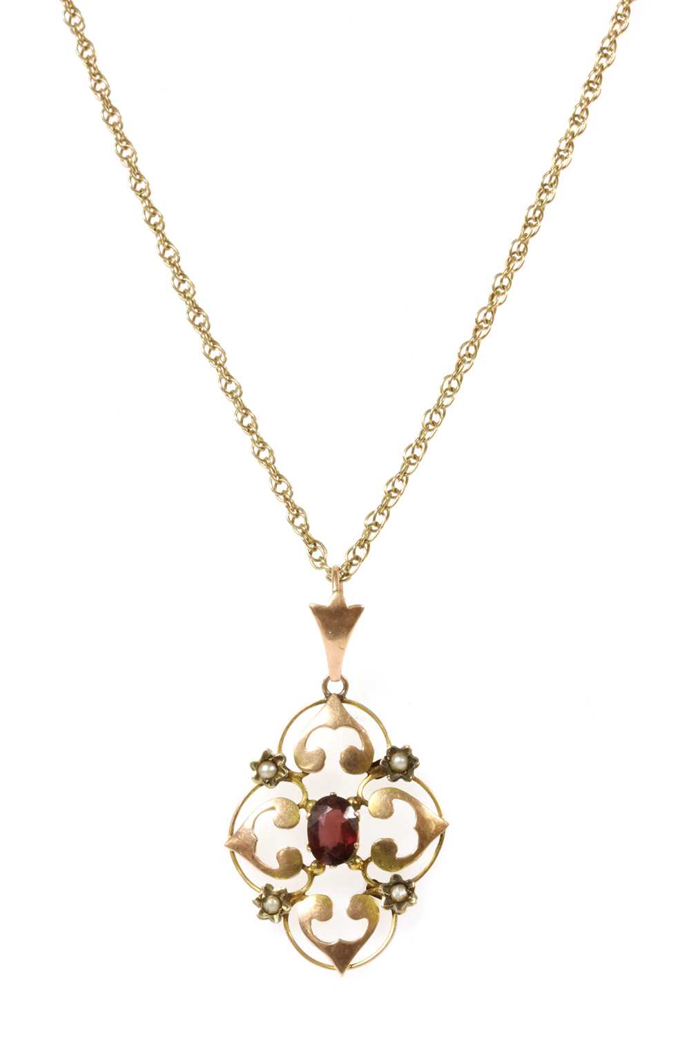 Lot 33 - An Edwardian gold garnet and split pearl pendant