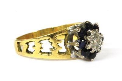 Lot 195 - A gold diamond and sapphire cluster ring