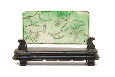 Lot 211 - A Chinese green jade panel