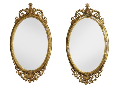 Lot 924 - A pair of Victorian gilt gesso oval wall mirrors