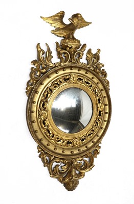 Lot 346 - A William IV-style giltwood convex wall mirror