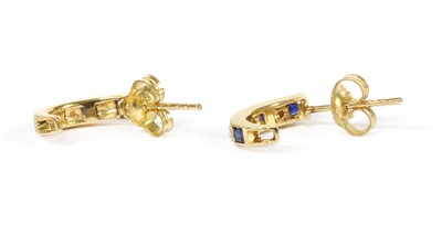 Lot 202 - A pair of gold sapphire and diamond 'J' hoop earrings