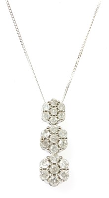 Lot 251 - A white gold diamond cluster pendant